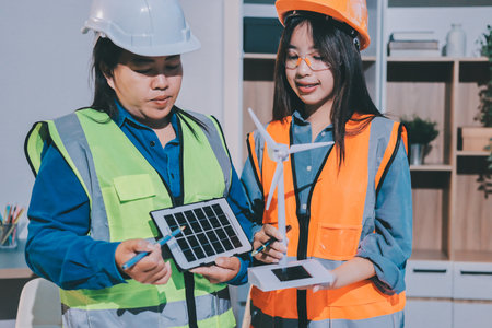 Architects and engineers working collaboratively on construction projectの写真素材