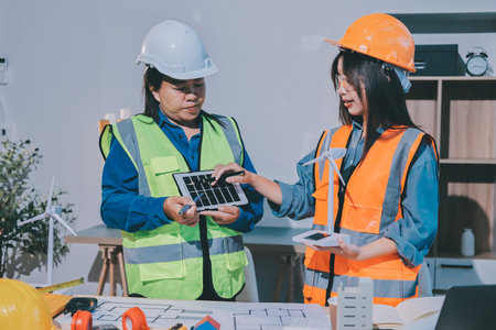 Architects and engineers working collaboratively on construction projectの写真素材