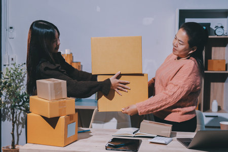 Asian woman selling clothes on camera live broadcast on social network at home, Online selling clothes on social media. Blogger woman influencer, SME retail store owner.の写真素材