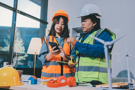 Architects and engineers working collaboratively on construction projectの写真素材