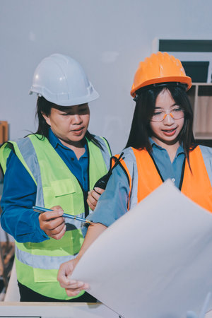 Architects and engineers working collaboratively on construction projectの写真素材