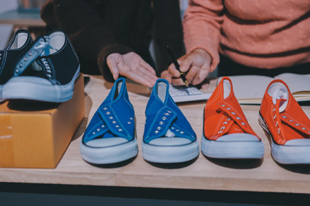 Asian woman selling clothes on camera live broadcast on social network at home, Online selling clothes on social media. Blogger woman influencer, SME retail store owner.の写真素材