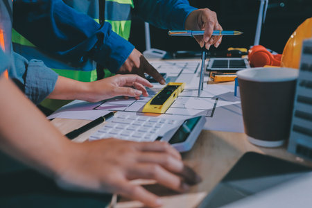 Architects and engineers working collaboratively on construction projectの写真素材