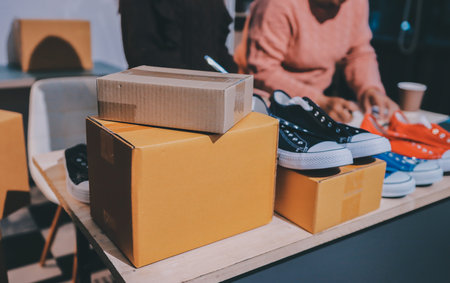 Asian woman selling clothes on camera live broadcast on social network at home, Online selling clothes on social media. Blogger woman influencer, SME retail store owner.の写真素材