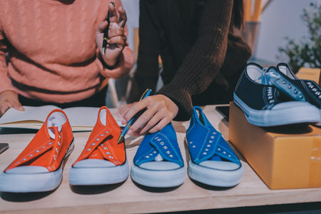 Asian woman describe selling clothes on camera live broadcast on social network at home, Online selling clothes on social media. Blogger woman influencer, SME retail store owner.の写真素材