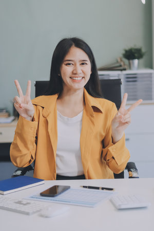 Business woman using calculator for math finance on wooden desk in office and business working...