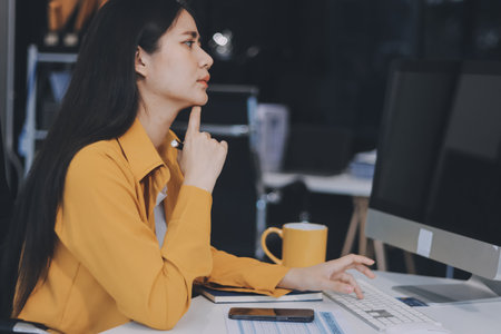 Business woman using calculator for do math finance on wooden desk in office and business working...