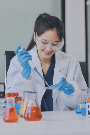 Portrait, science and happy woman on laptop in lab to research chemistry, test or innovation....