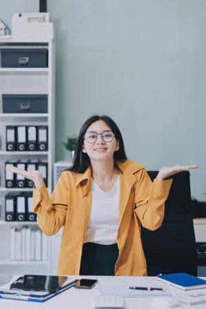 Business woman using calculator for do math finance on wooden desk in office and business working...