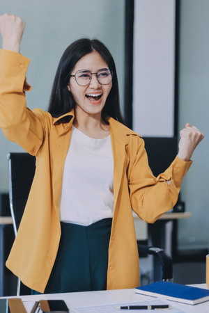 Business woman using calculator for math finance on wooden desk in office and business working background, accounting, statistics and analytic research concept.の写真素材