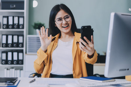 Business woman using calculator for do math finance on wooden desk in office and business working background, tax, accounting, statistics and analytic research concept.の写真素材