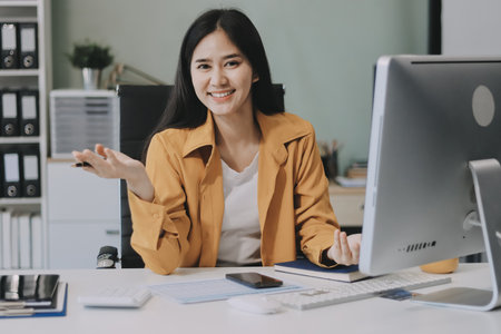 Business woman using calculator for do math finance on wooden desk in office and business working...