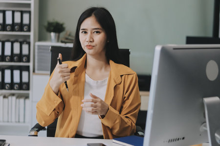 Business woman using calculator for do math finance on wooden desk in office and business working...