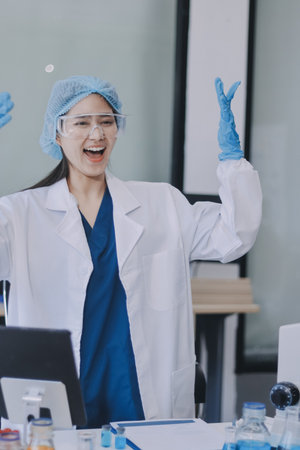 Portrait, science and happy woman on laptop in lab to research chemistry, test or innovation. Microscope, scientist and face of medical doctor in goggles for microbiology, healthcare or pharma studyの写真素材
