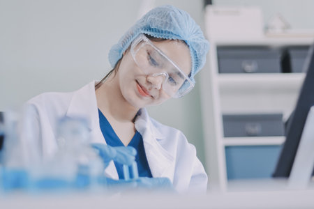Portrait, science and happy woman on laptop in lab to research chemistry, test or innovation....