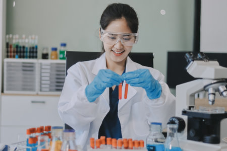 Portrait, science and happy woman on laptop in lab to research chemistry, test or innovation....