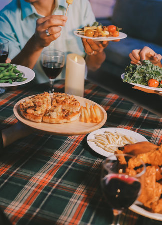 Diversity, dinner and group of people toast celebration together at party. Friends, happy and celebrate with food, wine and friendship for love, support and cheers champagne at business functionの写真素材