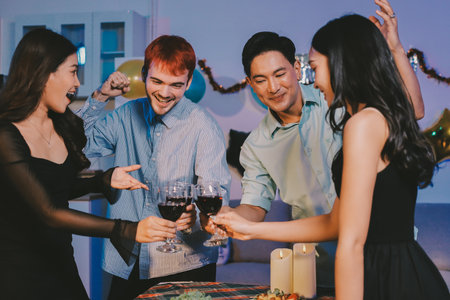 Diversity, dinner and group of people toast celebration together at party. Friends, happy and celebrate with food, wine and friendship for love, support and cheers champagne at business functionの写真素材