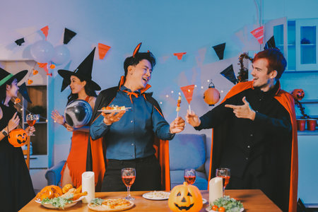 Joyful office Halloween party with coworkers in costumes, celebrating with drinks and laughter, fostering teamwork and festive spiritの写真素材