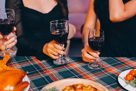 Diversity, dinner and group of people toast celebration together at party. Friends, happy and celebrate with food, wine and friendship for love, support and cheers champagne at business functionの写真素材