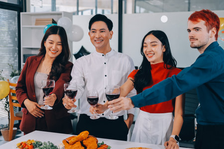 Diversity, dinner and group of people toast celebration together at party. Friends, happy and celebrate with food, wine and friendship for love, support and cheers champagne at business functionの写真素材