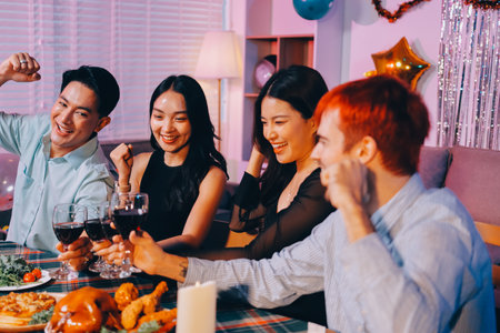 Diversity, dinner and group of people toast celebration together at party. Friends, happy and celebrate with food, wine and friendship for love, support and cheers champagne at business functionの写真素材