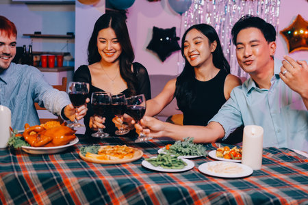 Diversity, dinner and group of people toast celebration together at party. Friends, happy and celebrate with food, wine and friendship for love, support and cheers champagne at business functionの写真素材