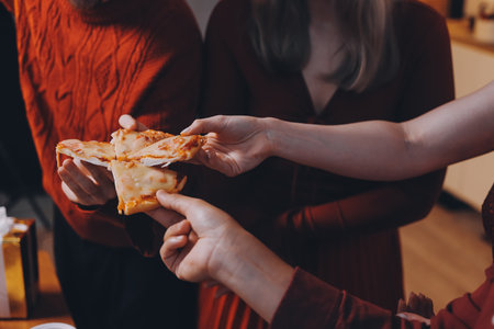 Festive Office Christmas Party with Delicious Food. A beautifully decorated office space with Christmas trees and festive lights, set up for a holiday party.の写真素材