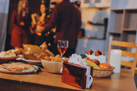 Festive Office Christmas Party with Delicious Food. A beautifully decorated office space with Christmas trees and festive lights, set up for a holiday party.の写真素材