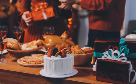 Festive Office Christmas Party with Delicious Food. A beautifully decorated office space with Christmas trees and festive lights, set up for a holiday party.の写真素材