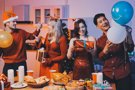 Festive Office Christmas Party with Delicious Food. A beautifully decorated office space with Christmas trees and festive lights, set up for a holiday party.の写真素材