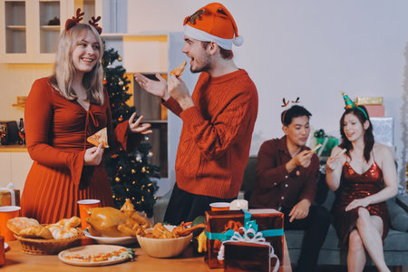 Festive Office Christmas Party with Delicious Food. A beautifully decorated office space with Christmas trees and festive lights, set up for a holiday party.の写真素材