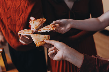Festive Office Christmas Party with Delicious Food. A beautifully decorated office space with Christmas trees and festive lights, set up for a holiday party.の写真素材