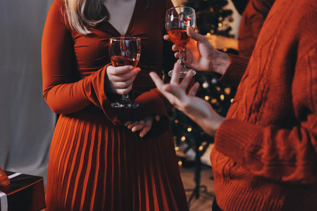 Festive Office Christmas Party with Delicious Food. A beautifully decorated office space with Christmas trees and festive lights, set up for a holiday party.の写真素材