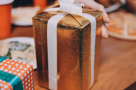 Festive Office Christmas Party with Delicious Food. A beautifully decorated office space with Christmas trees and festive lights, set up for a holiday party.の写真素材