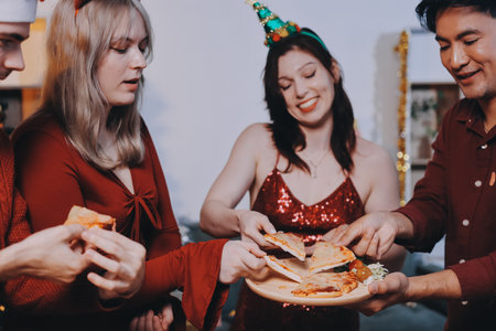 Festive Office Christmas Party with Delicious Food. A beautifully decorated office space with Christmas trees and festive lights, set up for a holiday party.の写真素材