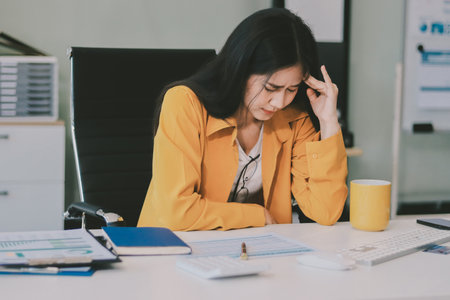 Headache, business woman at night and computer stress while working for a deadline with pc glitch. Sad corporate manager with anxiety about target working at desk screen late to complete task onlineの写真素材