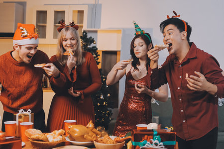 Festive Office Christmas Party with Delicious Food. A beautifully decorated office space with Christmas trees and festive lights, set up for a holiday party.の写真素材