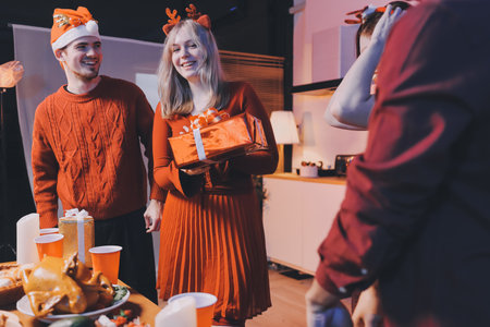 Festive Office Christmas Party with Delicious Food. A beautifully decorated office space with Christmas trees and festive lights, set up for a holiday party.の写真素材