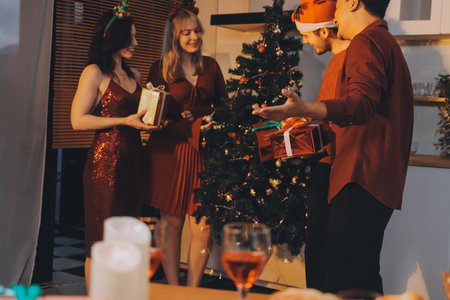 Festive Office Christmas Party with Delicious Food. A beautifully decorated office space with Christmas trees and festive lights, set up for a holiday party.の写真素材