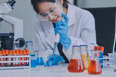 Portrait, science and happy woman on laptop in lab to research chemistry, test or innovation....