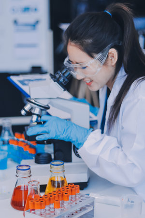 Portrait, science and happy woman on laptop in lab to research chemistry, test or innovation....