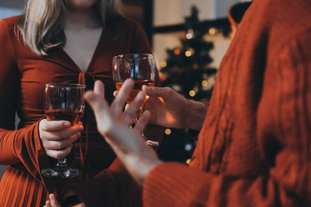 Festive Office Christmas Party with Delicious Food. A beautifully decorated office space with Christmas trees and festive lights, set up for a holiday party.の写真素材