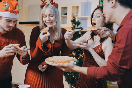 Festive Office Christmas Party with Delicious Food. A beautifully decorated office space with Christmas trees and festive lights, set up for a holiday party.の写真素材