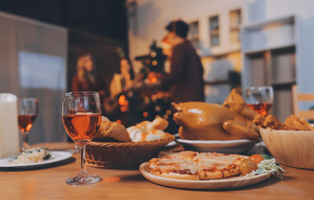 Festive Office Christmas Party with Delicious Food. A beautifully decorated office space with Christmas trees and festive lights, set up for a holiday party.の写真素材