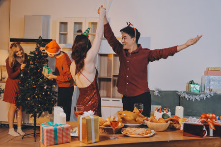 Festive Office Christmas Party with Delicious Food. A beautifully decorated office space with Christmas trees and festive lights, set up for a holiday party.の写真素材