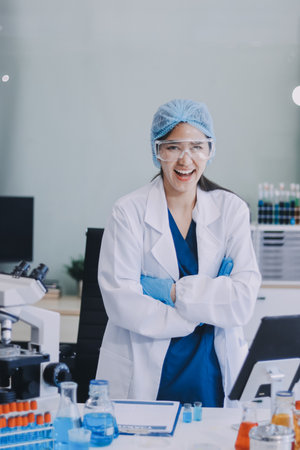 Portrait, science and happy woman on laptop in lab to research chemistry, test or innovation....