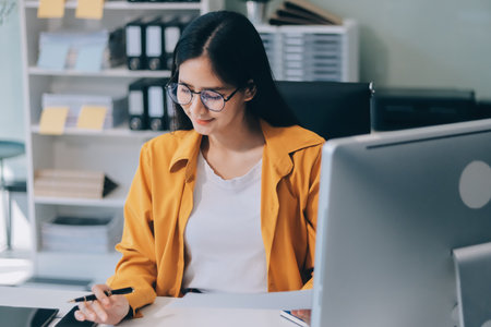 Business woman using calculator for do math finance on wooden desk in office and business working...