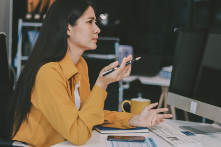 Business woman using calculator for math finance on wooden desk in office and business working...