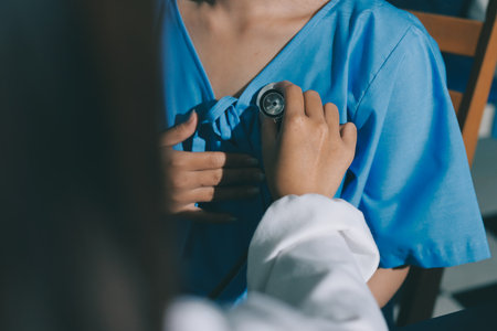 healthy concept; Doctor checking patient's heart with stethoscope